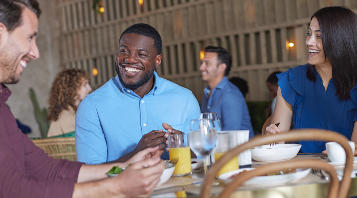 Man socializing with friends in a restaurant 